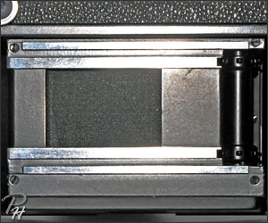 Horizontal focal-plane shutter with rubberized "Habutae" silk curtains